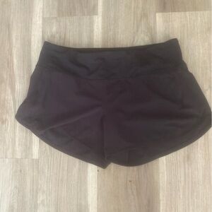 Brand new Lululemon black shorts with attached underwear. Excellent condition